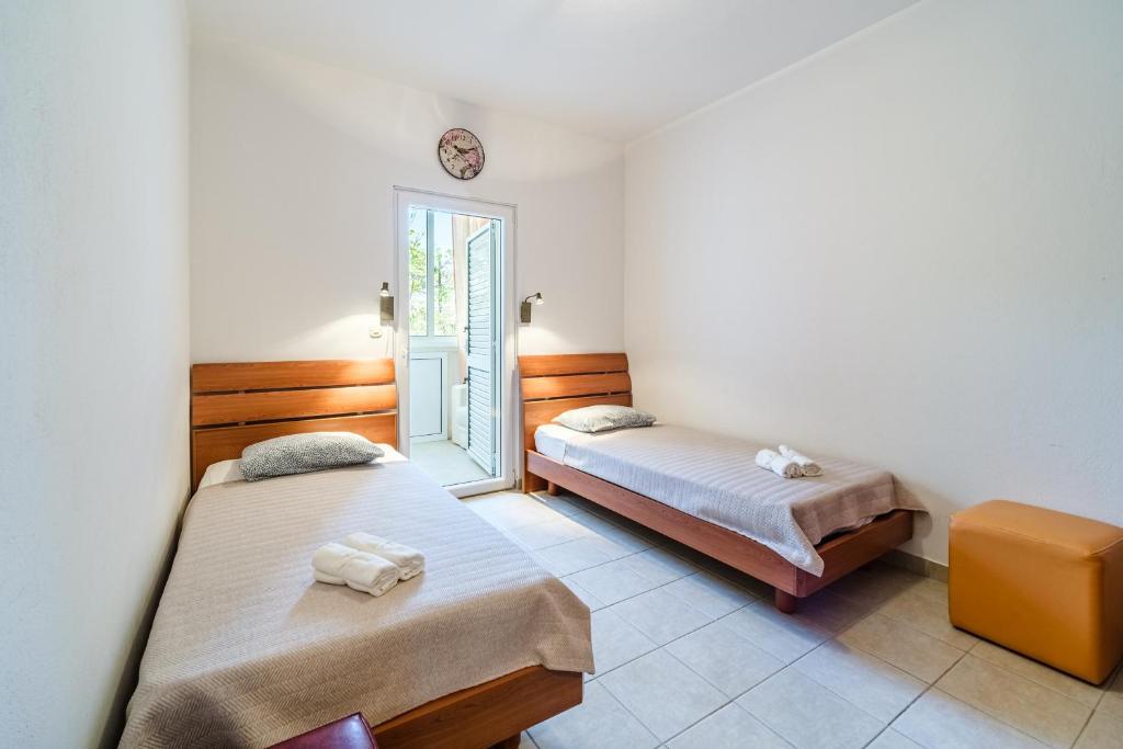 Postel nebo postele na pokoji v ubytování Apartment Elmira - Charme Holidays