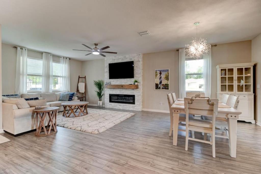 a living room with a table and a dining room at New St Augustine Waterview Home in Saint Augustine