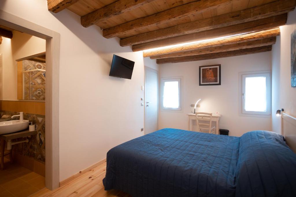 Postel nebo postele na pokoji v ubytování B&B Basta Bussare