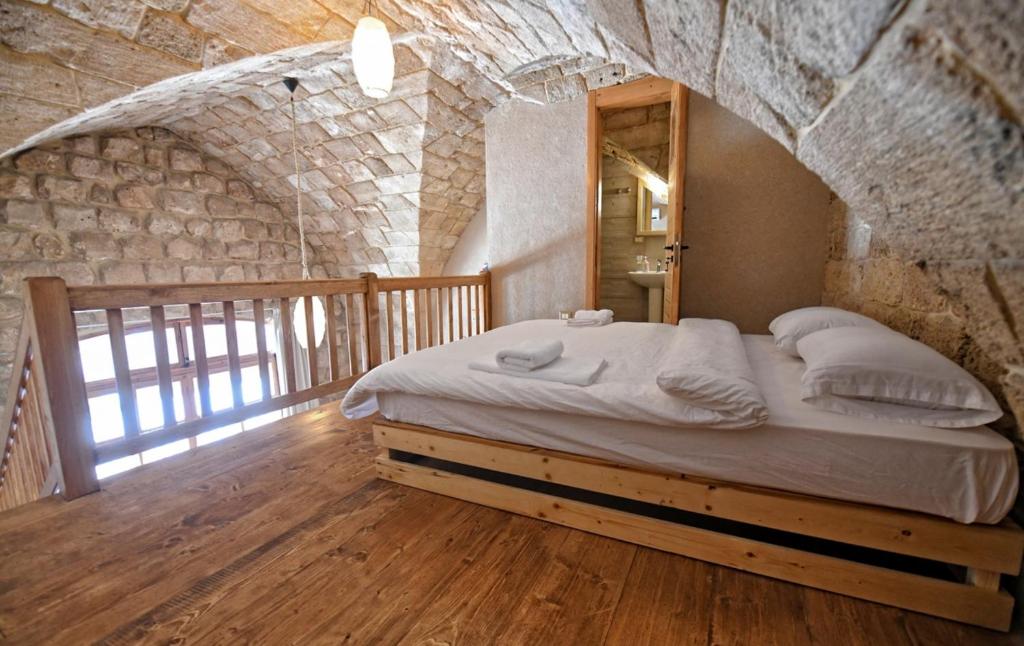 Postel nebo postele na pokoji v ubytování Old Town Guesthouses