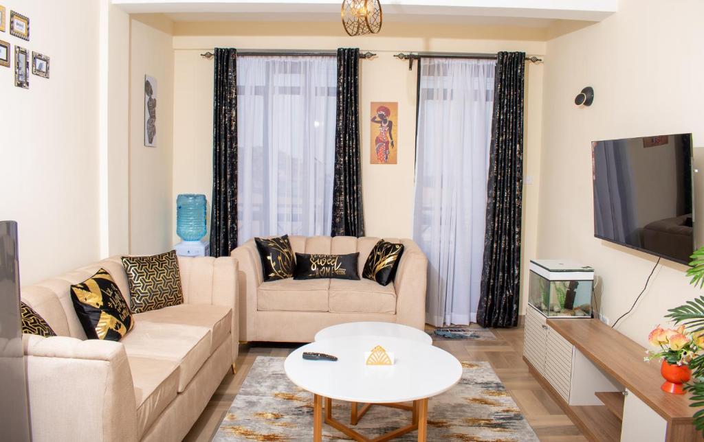TV a/nebo společenská místnost v ubytování Executive 1 Bedroom with Secure Parking Nakuru