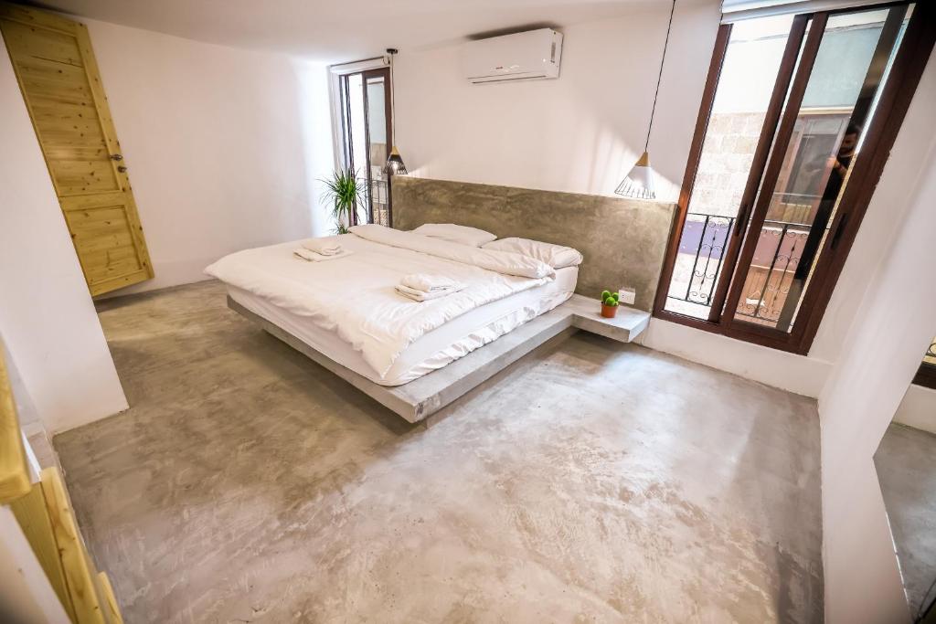 Postel nebo postele na pokoji v ubytování Old Town Guesthouses