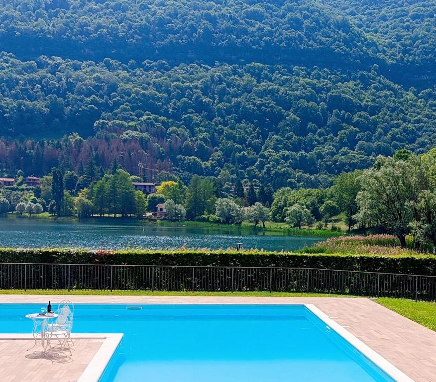 a swimming pool with a view of a lake at Casa Vacanze Alessandro in Spinone Al Lago