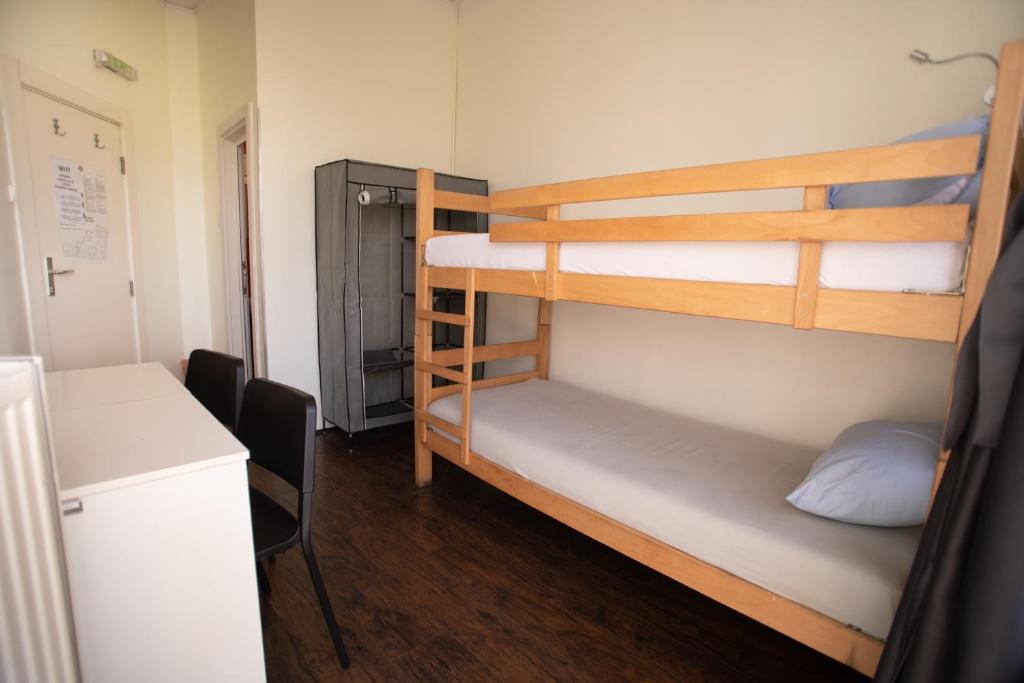 Postel nebo postele na pokoji v ubytování All in Hostel