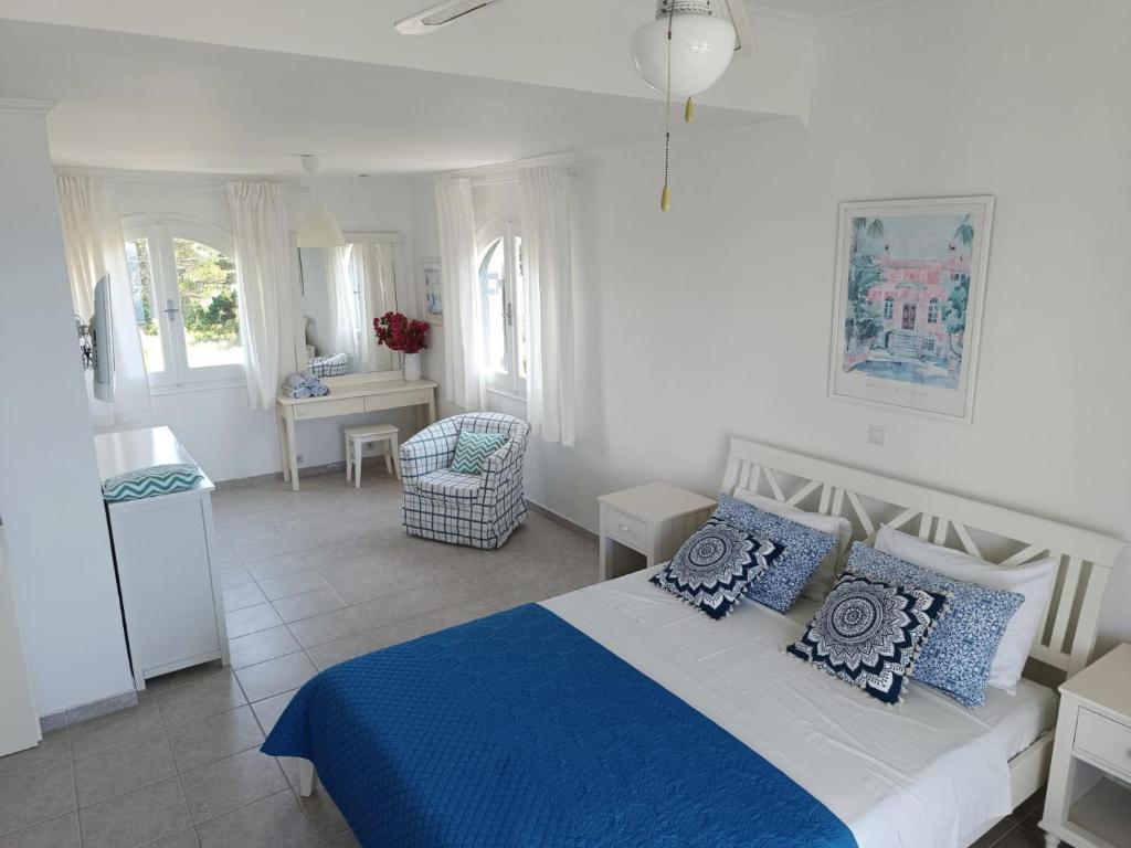 Postel nebo postele na pokoji v ubytování Seahorse Bay Beach Villa Halikounas