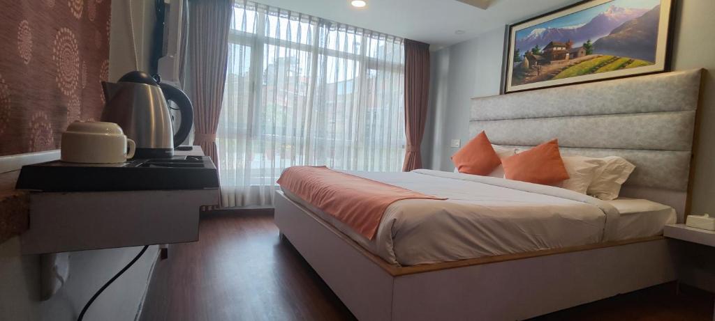 Postel nebo postele na pokoji v ubytování Durbar Hotel & Residence