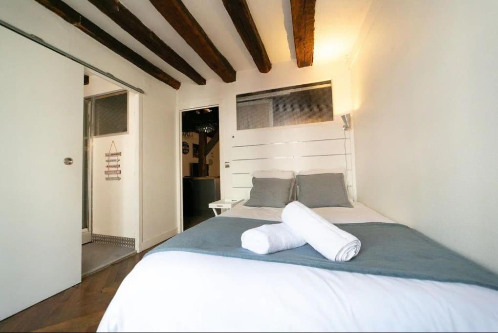 Llit o llits en una habitació de Le Bourgogne-HyperCentre