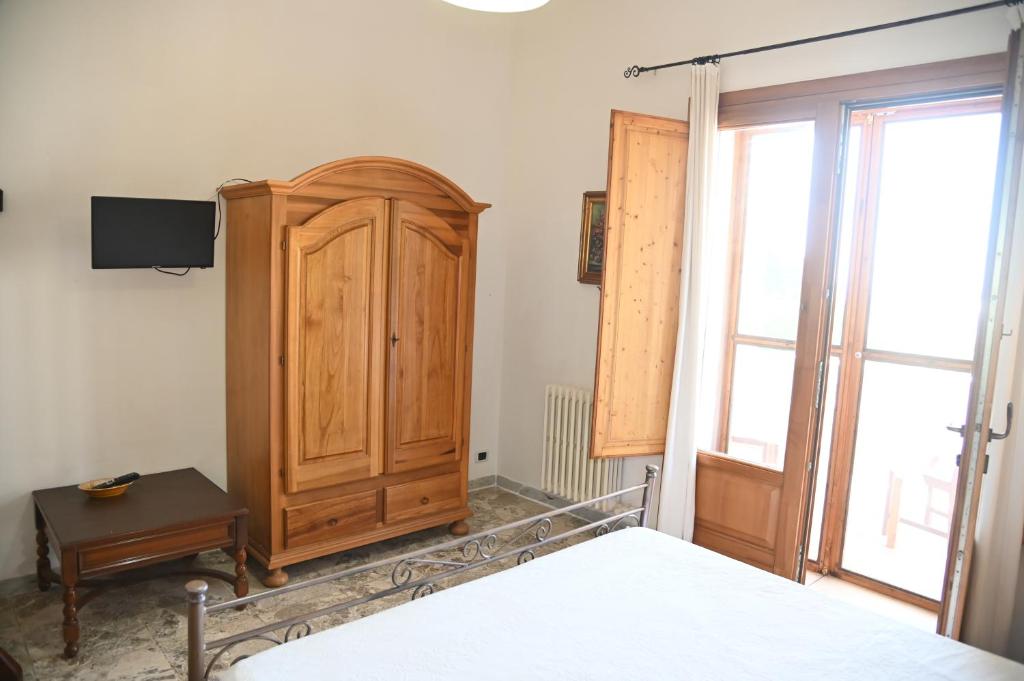 Postel nebo postele na pokoji v ubytování B&B Villa Dongiovanni