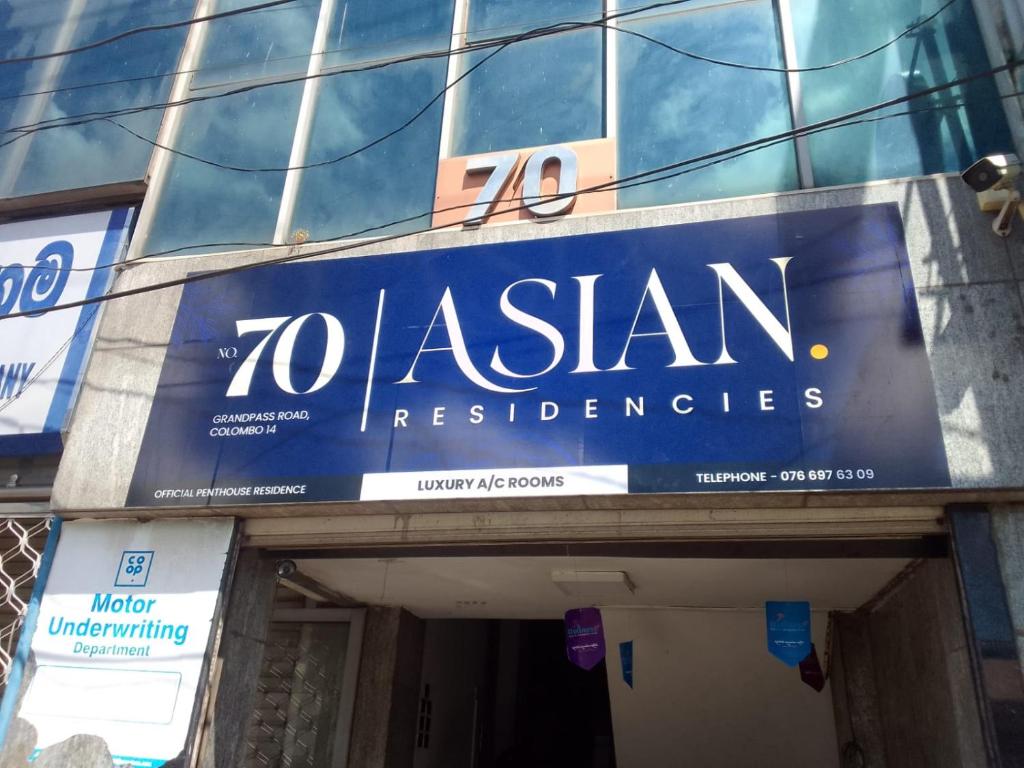 a sign on the side of a building at Asian Residencies - Grandpass in New Bazaar