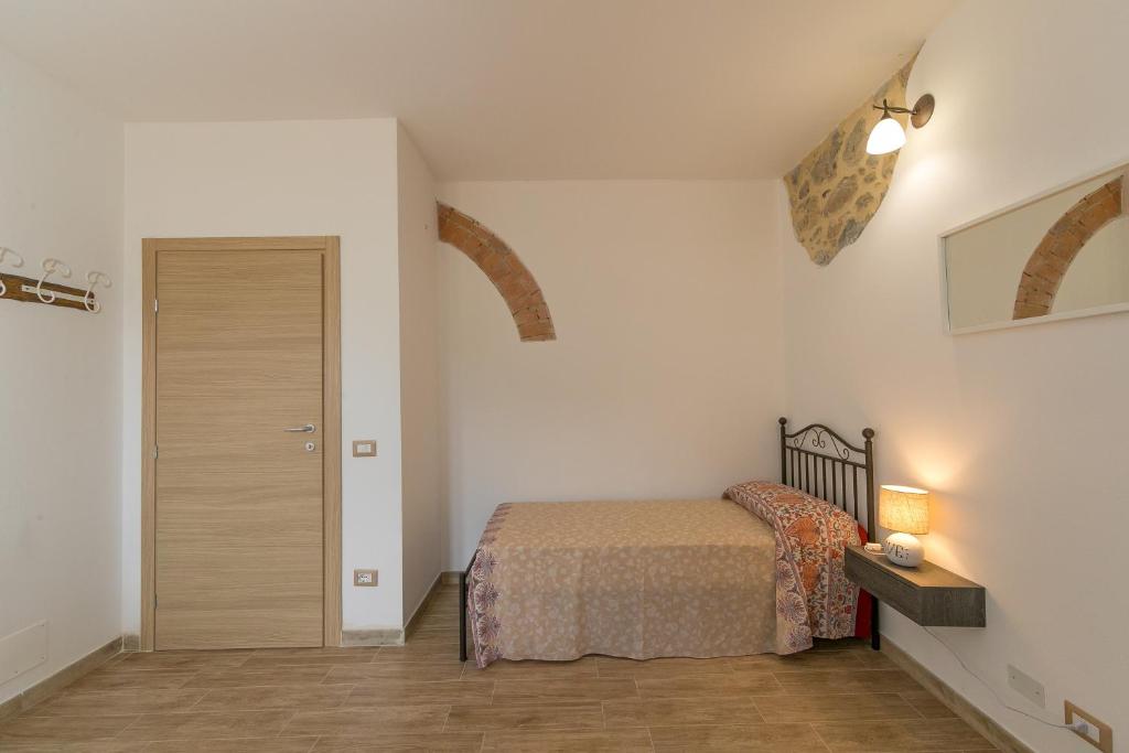 Postel nebo postele na pokoji v ubytování Villa Adelmo