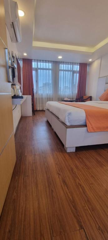 Postel nebo postele na pokoji v ubytování Durbar Hotel & Residence