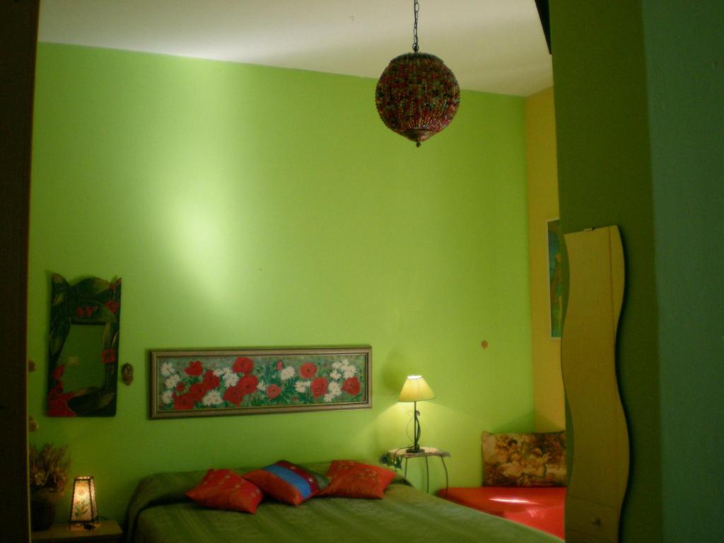 Łóżko lub łóżka w pokoju w obiekcie Orizzonte B&B