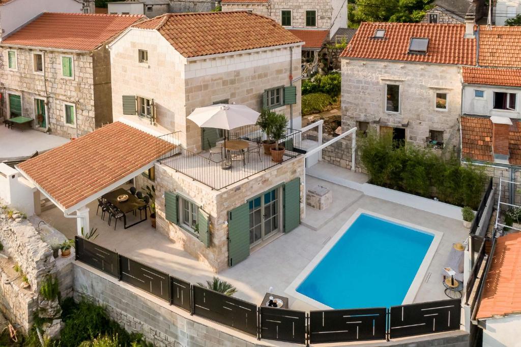 an aerial view of a house with a swimming pool at Villa Mara- Casa Rustica in Korčula