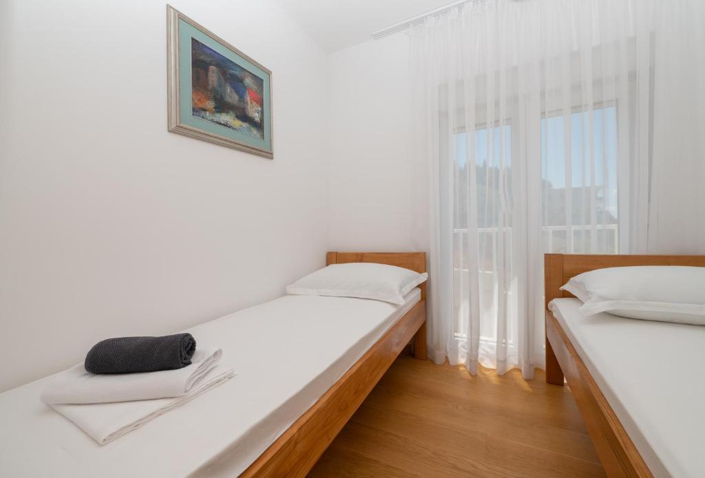 Posteľ alebo postele v izbe v ubytovaní Apartment Daniel