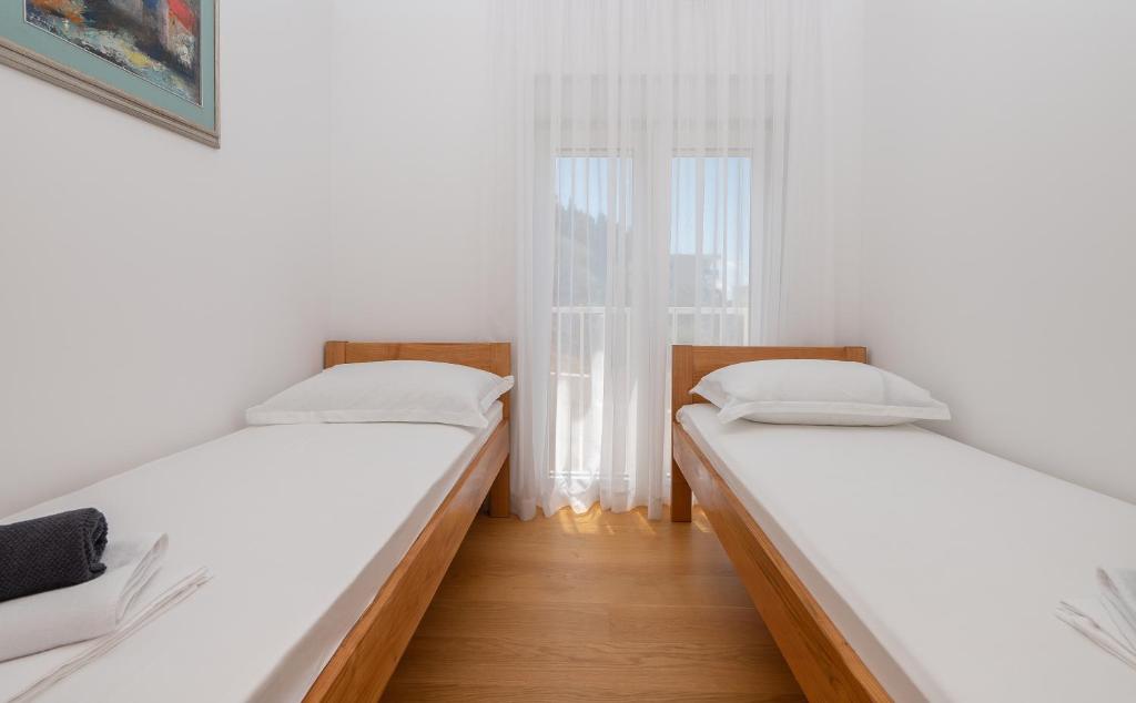 Posteľ alebo postele v izbe v ubytovaní Apartment Daniel