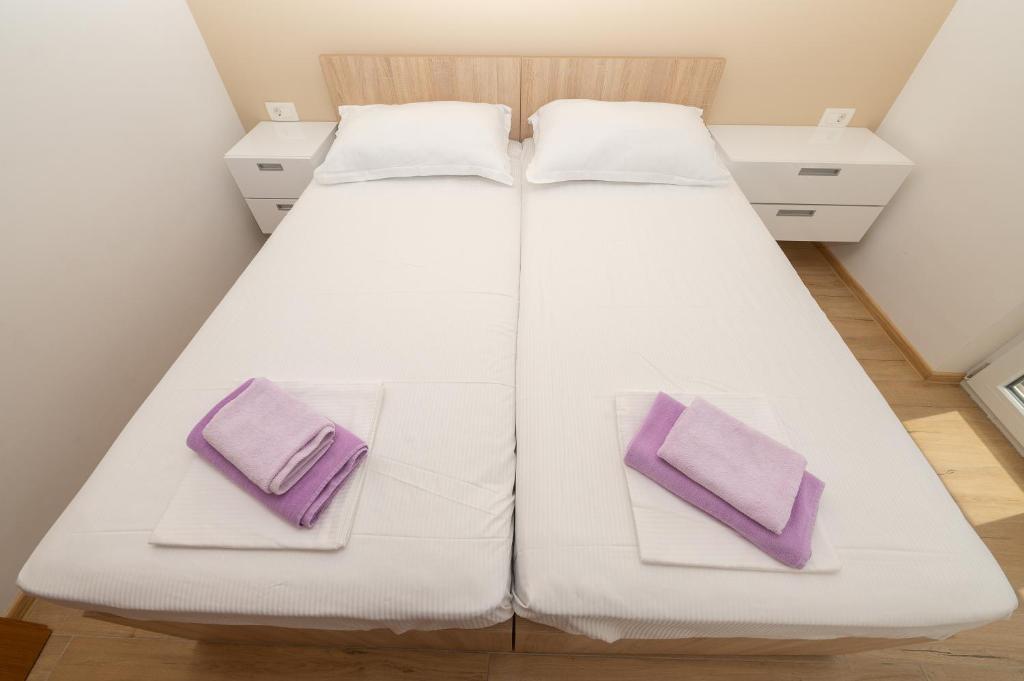 Posteľ alebo postele v izbe v ubytovaní Apartment Daniel
