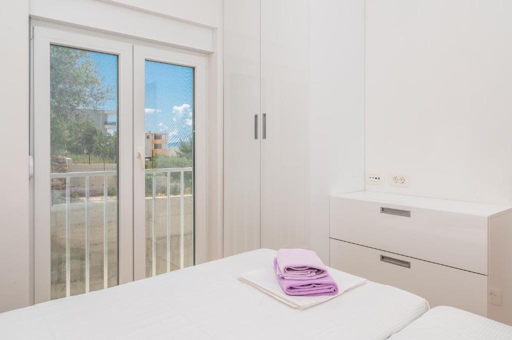 Posteľ alebo postele v izbe v ubytovaní Apartment Daniel