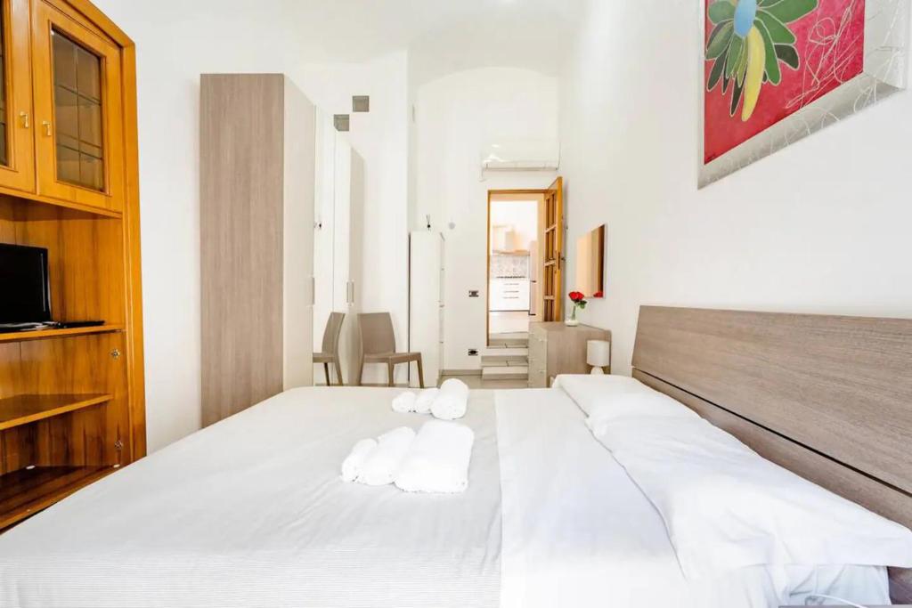 Postel nebo postele na pokoji v ubytování B&b SAN LORENZO