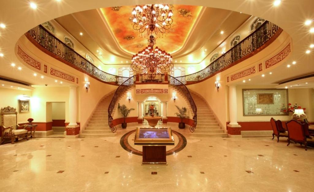 a large lobby with a chandelier in a building at Tuli Imperial in Nagpur