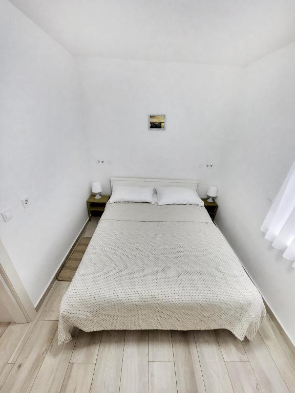 Posteľ alebo postele v izbe v ubytovaní Rosemarie Beach Suites Zadar