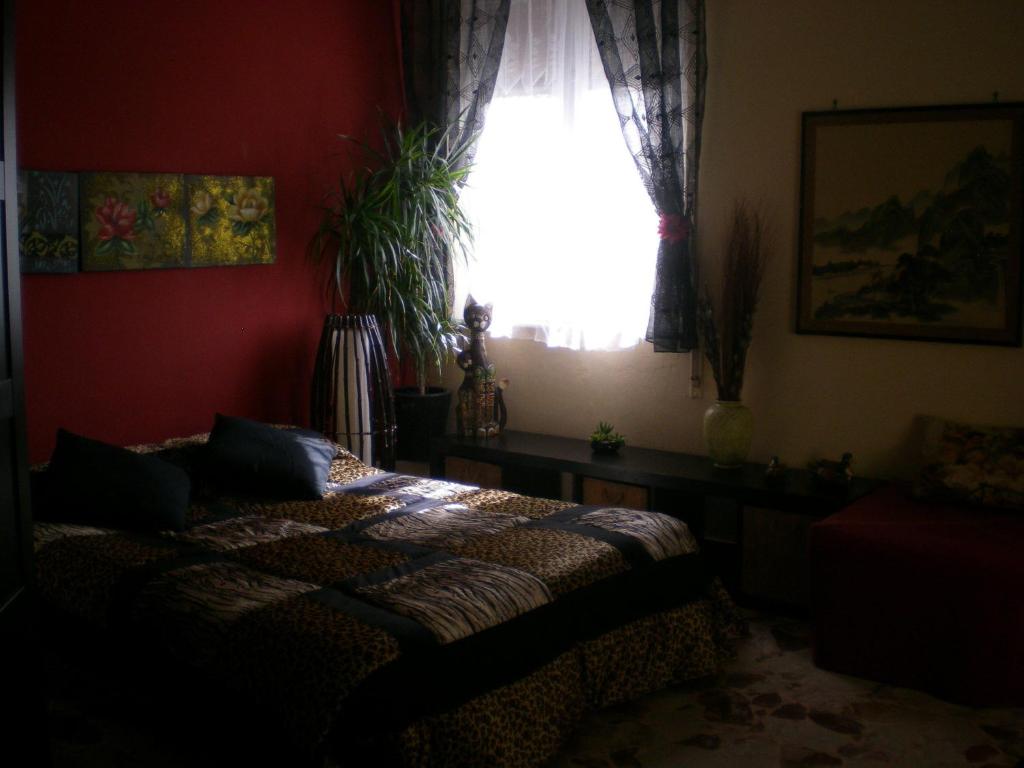 Łóżko lub łóżka w pokoju w obiekcie Orizzonte B&B