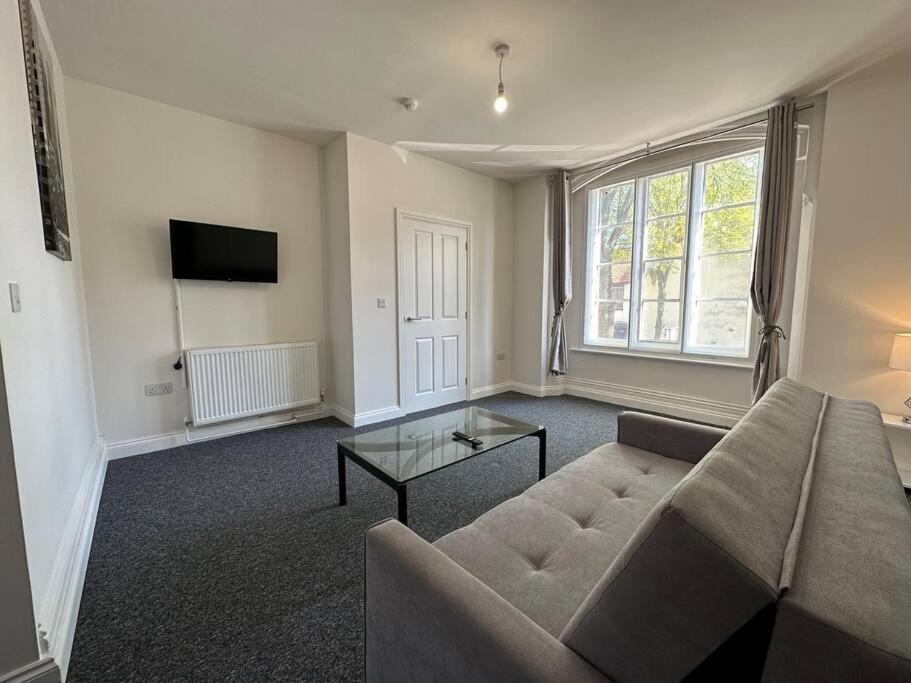 a living room with a couch and a tv at 1 Bed Central Newark Flat 1st Floor in Newark upon Trent