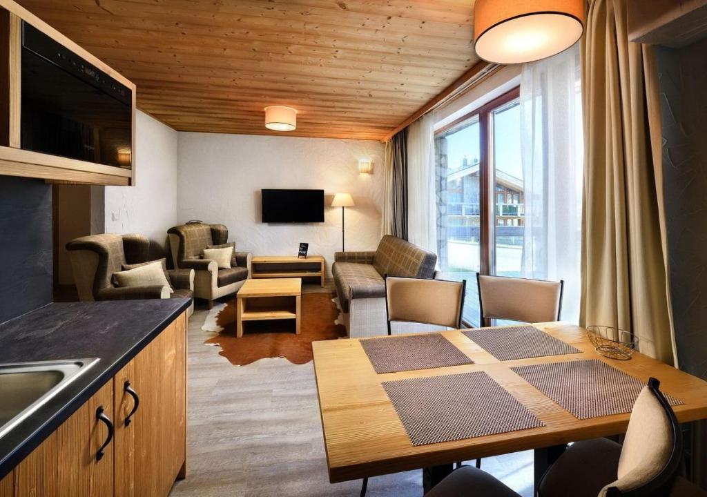 TV a/nebo společenská místnost v ubytování Chalets Jasná Collection - Apartments