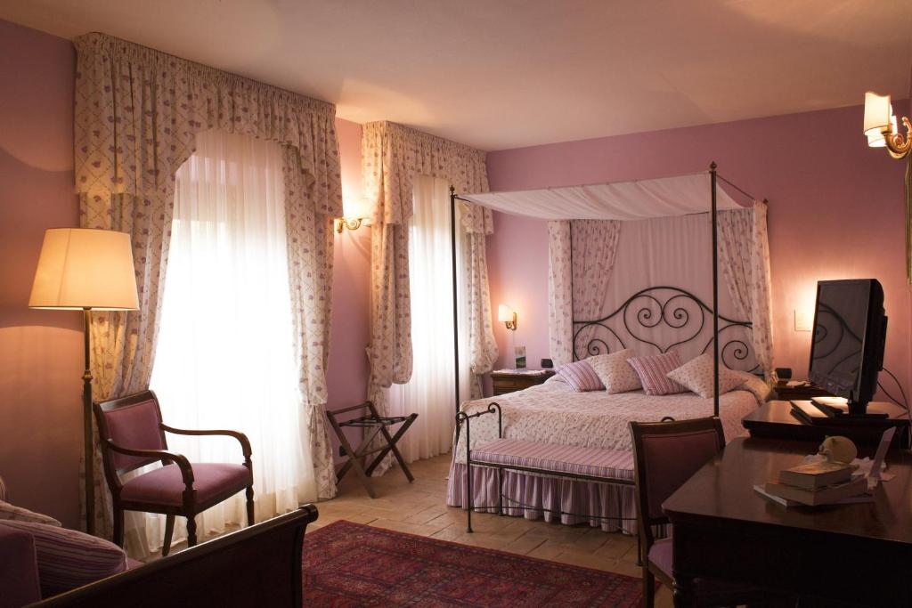 Posteľ alebo postele v izbe v ubytovaní Relais Osteria Dell'Orcia