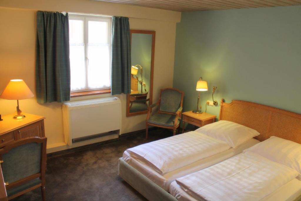 Postel nebo postele na pokoji v ubytování Hotel BurgGartenpalais