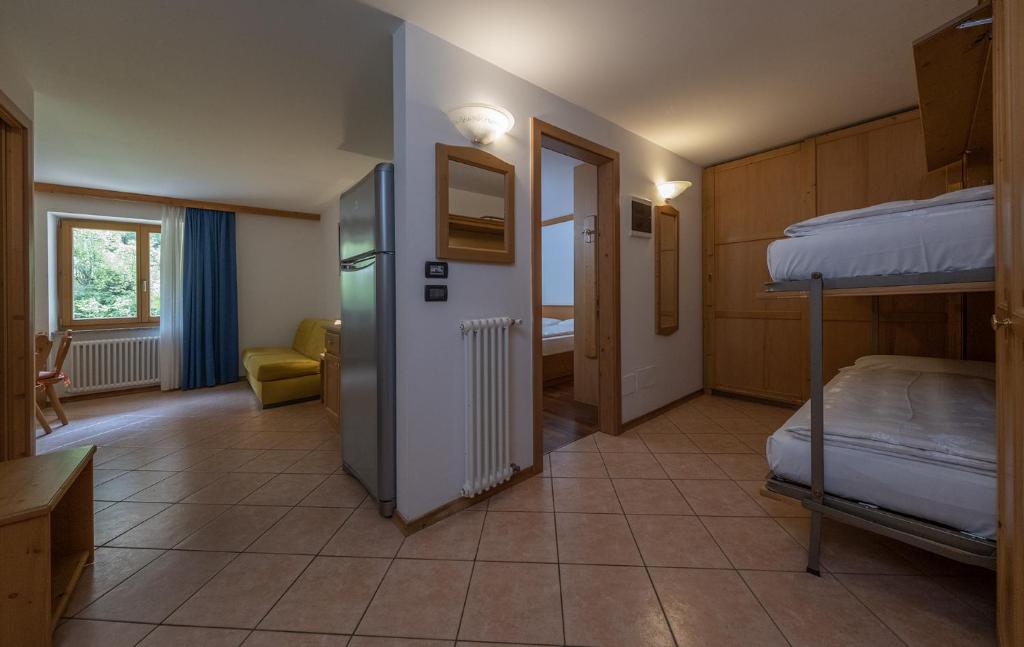 Postel nebo postele na pokoji v ubytování Residence Kristall- Fiemme Holidays
