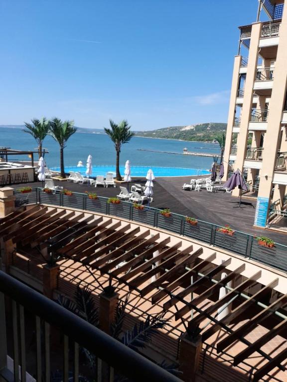 a view of the ocean from the balcony of a hotel at Port Balchik apartment in Balchik