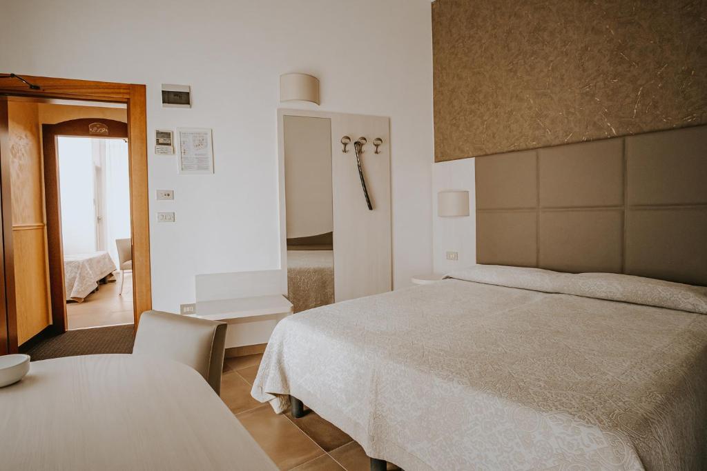 Postel nebo postele na pokoji v ubytování Hotel Gabriella