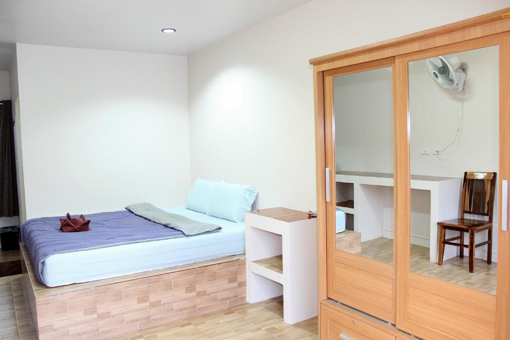 Postel nebo postele na pokoji v ubytování Sairee Center Guest House