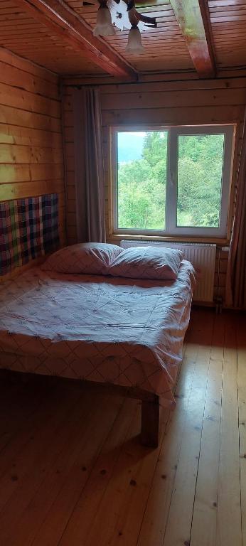 Postel nebo postele na pokoji v ubytování Крайня Хата