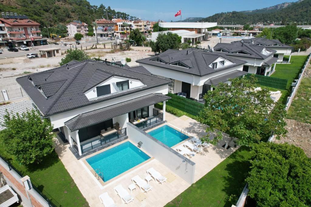 an aerial view of a house with a swimming pool at HACI BEY VİLLALARI in Kemer