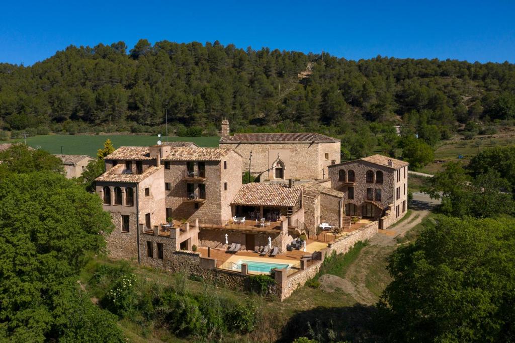 an aerial view of a large stone house at Can Morei in Orpí