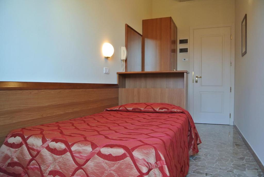 Postel nebo postele na pokoji v ubytování Hotel Tiffany