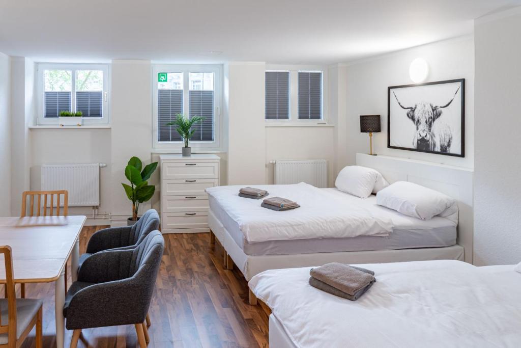 Postel nebo postele na pokoji v ubytování CBlue "Apartments am Hauptbahnhof"