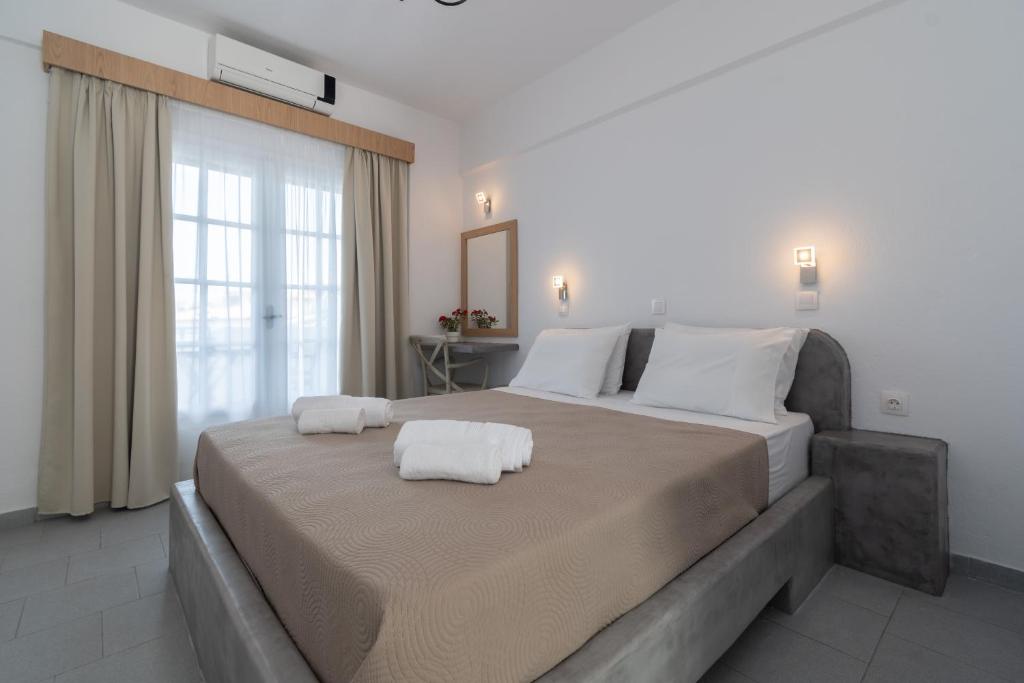Postel nebo postele na pokoji v ubytování Astri Hotel