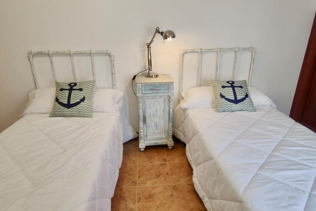 Łóżko lub łóżka w pokoju w obiekcie Apartamento Porto do Xufre