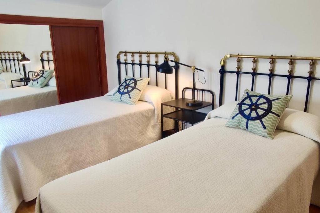 Łóżko lub łóżka w pokoju w obiekcie Apartamento Porto do Xufre