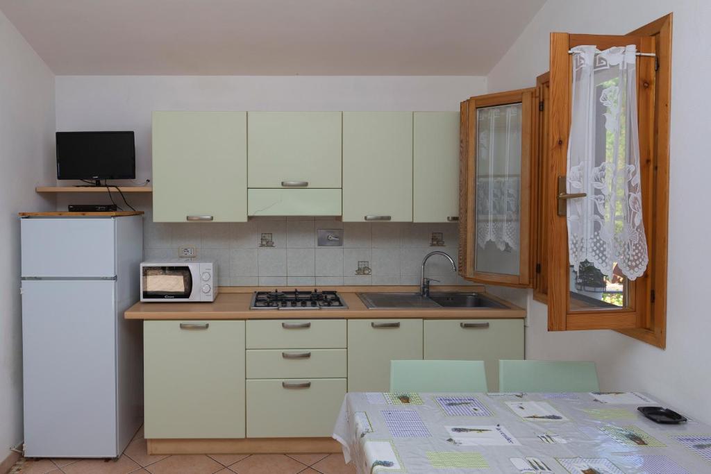 Kuchyň nebo kuchyňský kout v ubytování Residenza Miramare - HelloElba