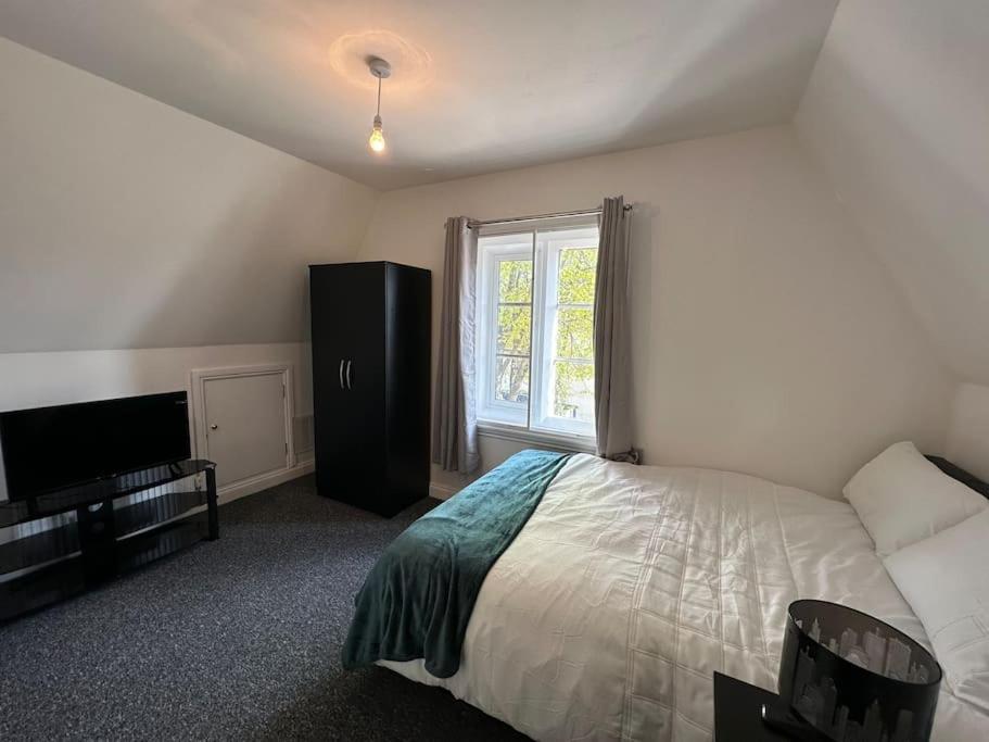 a bedroom with a bed and a window at 1 Bed Central Newark Flat 2nd Floor in Newark upon Trent