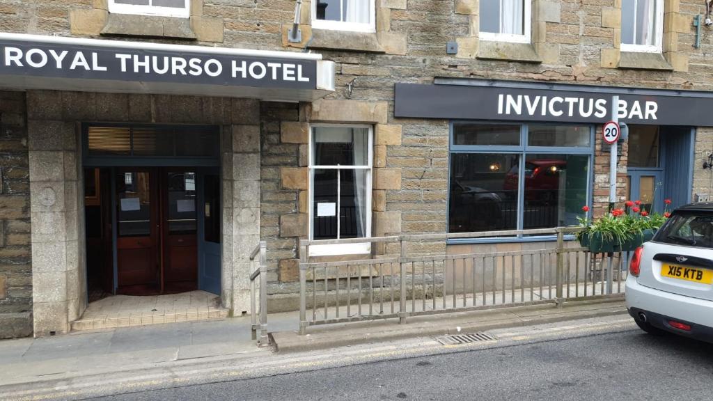 a hotel with a car parked in front of it at Royal Thurso Hotel in Thurso