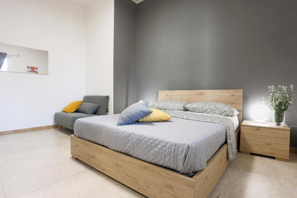 Postel nebo postele na pokoji v ubytování Boscoreale Vanilla Flats Free Parking