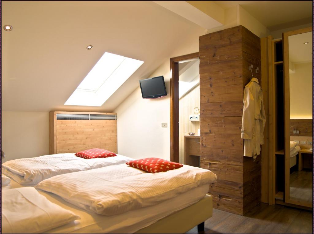 Postel nebo postele na pokoji v ubytování Hotel Pangrazzi - 3 stelle superior