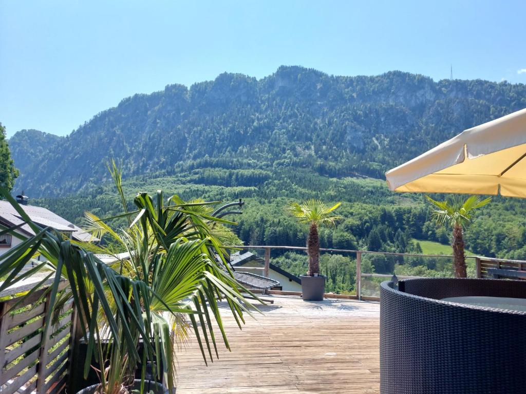 a patio with a view of a mountain at Ferienhaus Goldener Anker Unterach am Attersee in Unterach am Attersee