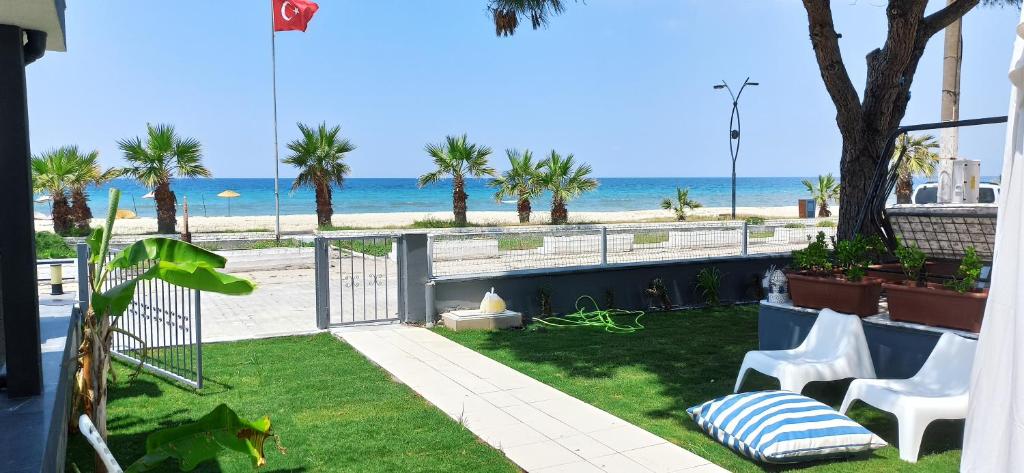 a patio with a view of the beach at Villa Plaj in Kusadası