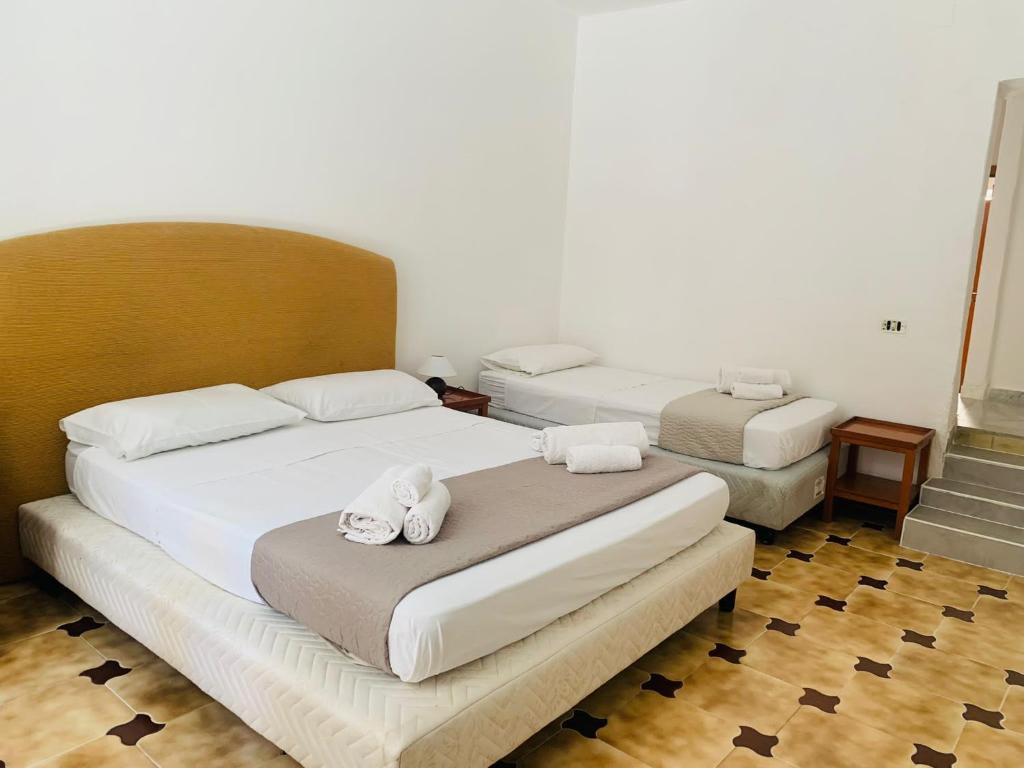 Ein Bett oder Betten in einem Zimmer der Unterkunft Bonorum Santa Sofia
