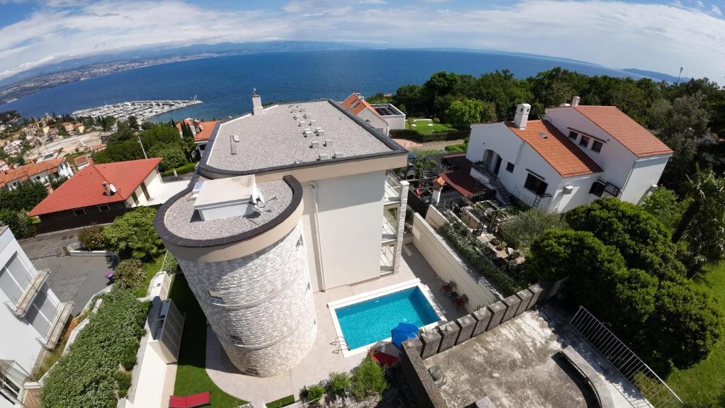 an aerial view of a house with a water tower at Villa Sunny Ičići- Apartment Sun in Ičići